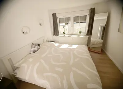 Ein Bett oder Betten in einem Zimmer der Unterkunft Ferienwohnung Balduin