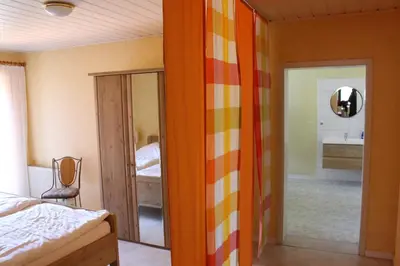 Ein Bett oder Betten in einem Zimmer der Unterkunft Weingut Gorges-Reinhard
