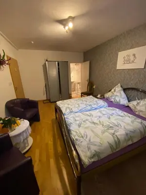 Ein Bett oder Betten in einem Zimmer der Unterkunft Zimmer 2 inkl eigenem Bad