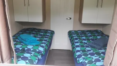 Ein Bett oder Betten in einem Zimmer der Unterkunft Ferienhaus 2 Chalet
