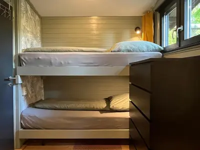 Ein Bett oder Betten in einem Zimmer der Unterkunft Idyllisches Ferienhaus im Wald unweit der Loreley