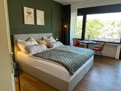 Ein Bett oder Betten in einem Zimmer der Unterkunft Festungsblick am Rhein - Panorama Suite