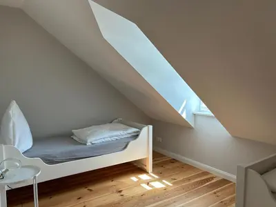 Ein Bett oder Betten in einem Zimmer der Unterkunft gemütliches Ferienhaus nahe Trier