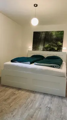 Ein Bett oder Betten in einem Zimmer der Unterkunft Ferienwohnung Sonnenwinkel
