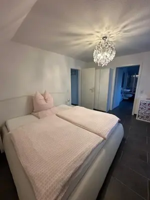 Ein Bett oder Betten in einem Zimmer der Unterkunft Ferienwohnung JODIS