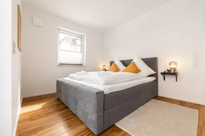 Ein Bett oder Betten in einem Zimmer der Unterkunft Golden Timber Suite