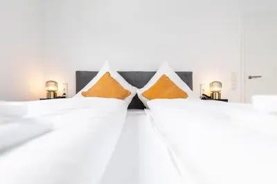 Ein Bett oder Betten in einem Zimmer der Unterkunft Golden Timber Suite