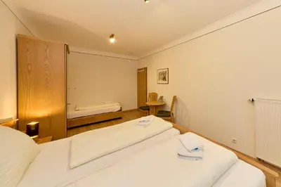 Ein Bett oder Betten in einem Zimmer der Unterkunft Gästehaus Binz-Meyer Fewo Schlossberg