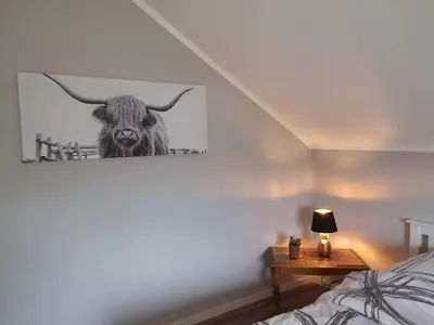 Ein Bett oder Betten in einem Zimmer der Unterkunft Ferienwohnung 