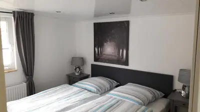 Ein Bett oder Betten in einem Zimmer der Unterkunft Ferienhaus 8