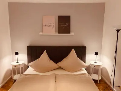 Ein Bett oder Betten in einem Zimmer der Unterkunft Ferienwohnung De Lorenzi