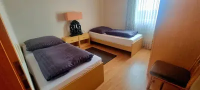 Ein Bett oder Betten in einem Zimmer der Unterkunft Landhaus Sauerburgblick