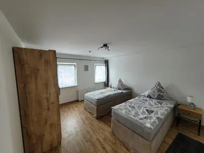 Ein Bett oder Betten in einem Zimmer der Unterkunft Gemütliches Dachapartment