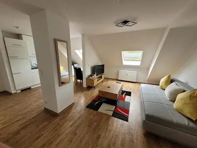 Ein Sitzbereich in der Unterkunft Gemütliches Dachapartment