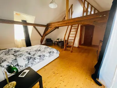 Ein Bett oder Betten in einem Zimmer der Unterkunft Ehemaliges Wein Chateau
