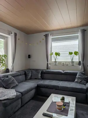 Ein Sitzbereich in der Unterkunft Ferienhaus An der Quell