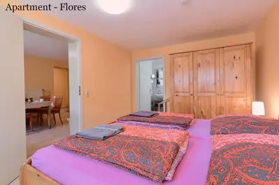 Ein Bett oder Betten in einem Zimmer der Unterkunft Villa Vici - Ferienwohnungen