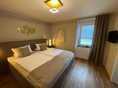 Ein Bett oder Betten in einem Zimmer der Unterkunft Mosel-Wohnen II - FERIENLAND COCHEM - Ellenz-Poltersdorf