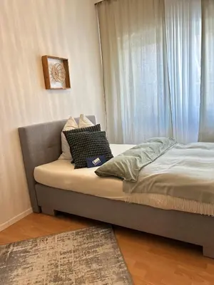 Ein Bett oder Betten in einem Zimmer der Unterkunft City Apartment Nähe Uni mit Parkplatz