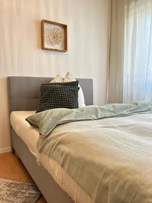 Ein Bett oder Betten in einem Zimmer der Unterkunft City Apartment Nähe Uni mit Parkplatz