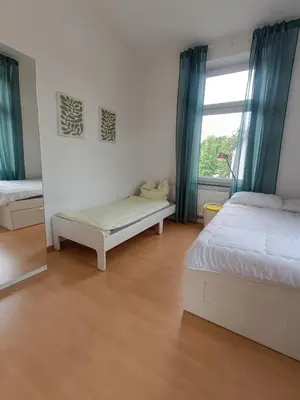 Ein Bett oder Betten in einem Zimmer der Unterkunft Wohnung am Schlosspark