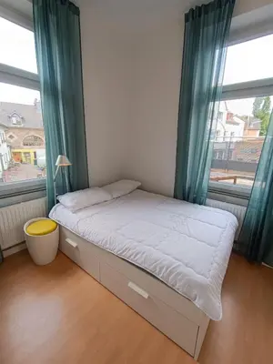 Ein Bett oder Betten in einem Zimmer der Unterkunft Wohnung am Schlosspark