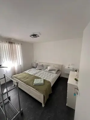 Ein Bett oder Betten in einem Zimmer der Unterkunft Ferienwohnung Zeciri