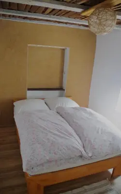Ein Bett oder Betten in einem Zimmer der Unterkunft Charmanter Altbau in Ortskernlage