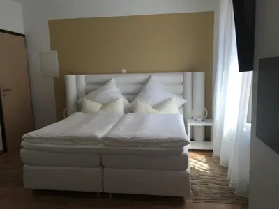 Ein Bett oder Betten in einem Zimmer der Unterkunft Moselperle Hotel Restaurant
