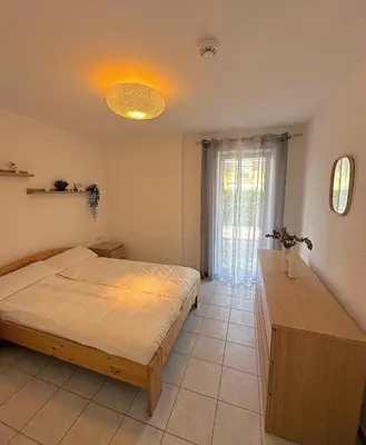Ein Bett oder Betten in einem Zimmer der Unterkunft Ferienwohnung Kornotti