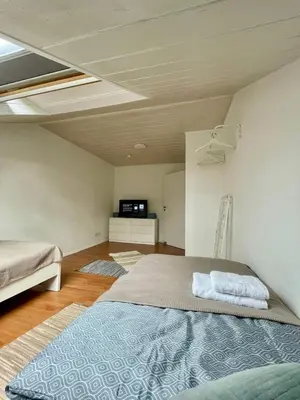 Ein Bett oder Betten in einem Zimmer der Unterkunft Charmante Dachgeschosswohnung bis zu 6 Gäste