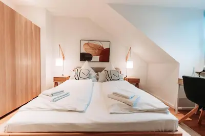 Ein Bett oder Betten in einem Zimmer der Unterkunft Ruhige Wohnung mit Festungsblick bei der Koblenz Hbf