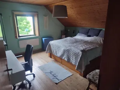 Ein Bett oder Betten in einem Zimmer der Unterkunft Ferienhaus Eifel Lotti