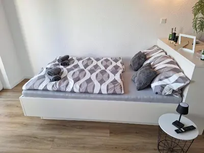 Ein Bett oder Betten in einem Zimmer der Unterkunft Apartment Deluxe mit Balkon Eifel Prüm