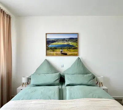 Ein Bett oder Betten in einem Zimmer der Unterkunft Ferienwohnung Burgstraße