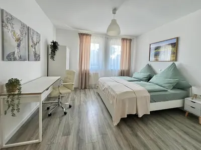 Ein Bett oder Betten in einem Zimmer der Unterkunft Ferienwohnung Burgstraße