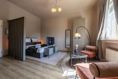 Ein Bett oder Betten in einem Zimmer der Unterkunft LLR Design Apartment - Loft Grey