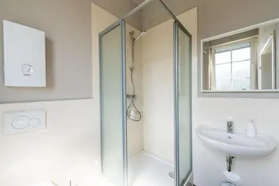 Ein Badezimmer in der Unterkunft LLR Design Apartment - Loft Grey