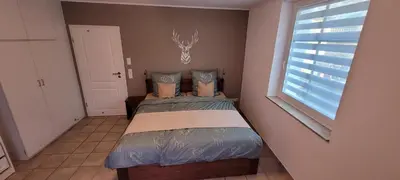 Ein Bett oder Betten in einem Zimmer der Unterkunft Ferienwohnung Eduard