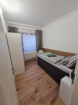 Ein Bett oder Betten in einem Zimmer der Unterkunft Ferienwohnungen Hilt