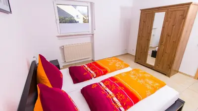 Ein Bett oder Betten in einem Zimmer der Unterkunft Weingut Roth