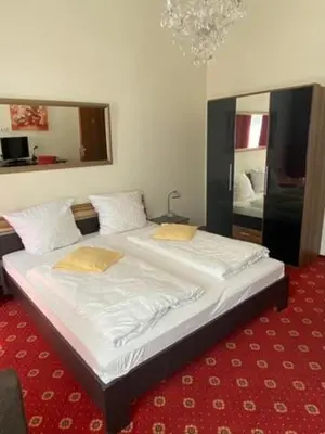 Ein Bett oder Betten in einem Zimmer der Unterkunft Hotel Bernkasteler Hof