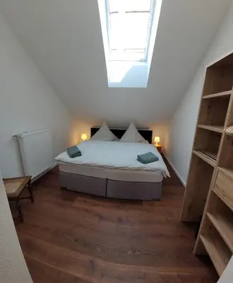 Ein Bett oder Betten in einem Zimmer der Unterkunft Scheune Am alten Posthof Lieser