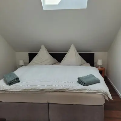 Ein Bett oder Betten in einem Zimmer der Unterkunft Scheune Am alten Posthof Lieser