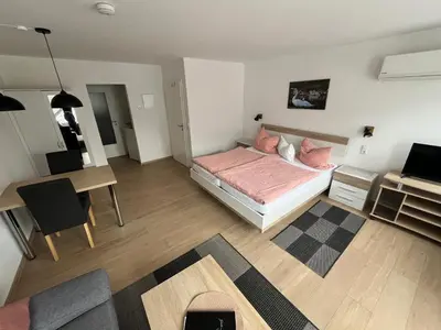 Ein Bett oder Betten in einem Zimmer der Unterkunft Ferienwohnungen und Appartements - Haus Budinger