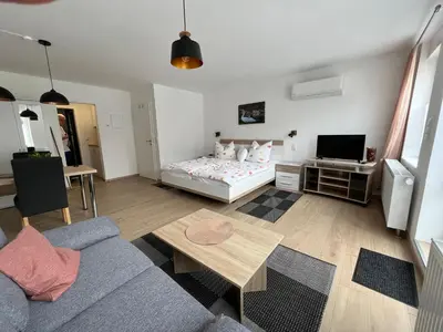 Ein Bett oder Betten in einem Zimmer der Unterkunft Ferienwohnungen und Appartements - Haus Budinger