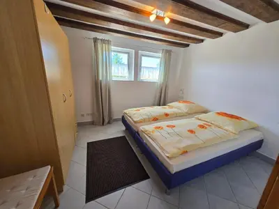 Ein Bett oder Betten in einem Zimmer der Unterkunft Appartement am Landhaus