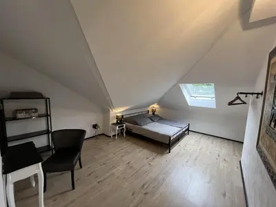 Ein Bett oder Betten in einem Zimmer der Unterkunft Ferienwohnung mit Sauna und Pool
