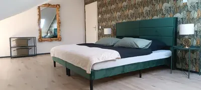 Ein Bett oder Betten in einem Zimmer der Unterkunft Ferienwohnung mit Sauna und Pool