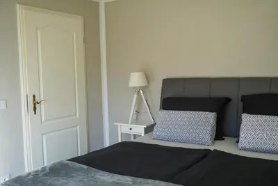 Ein Bett oder Betten in einem Zimmer der Unterkunft Ferienwohnung mit Sauna und Pool